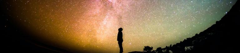 Silhouette against starry sky - Greg Razoky via Unsplash